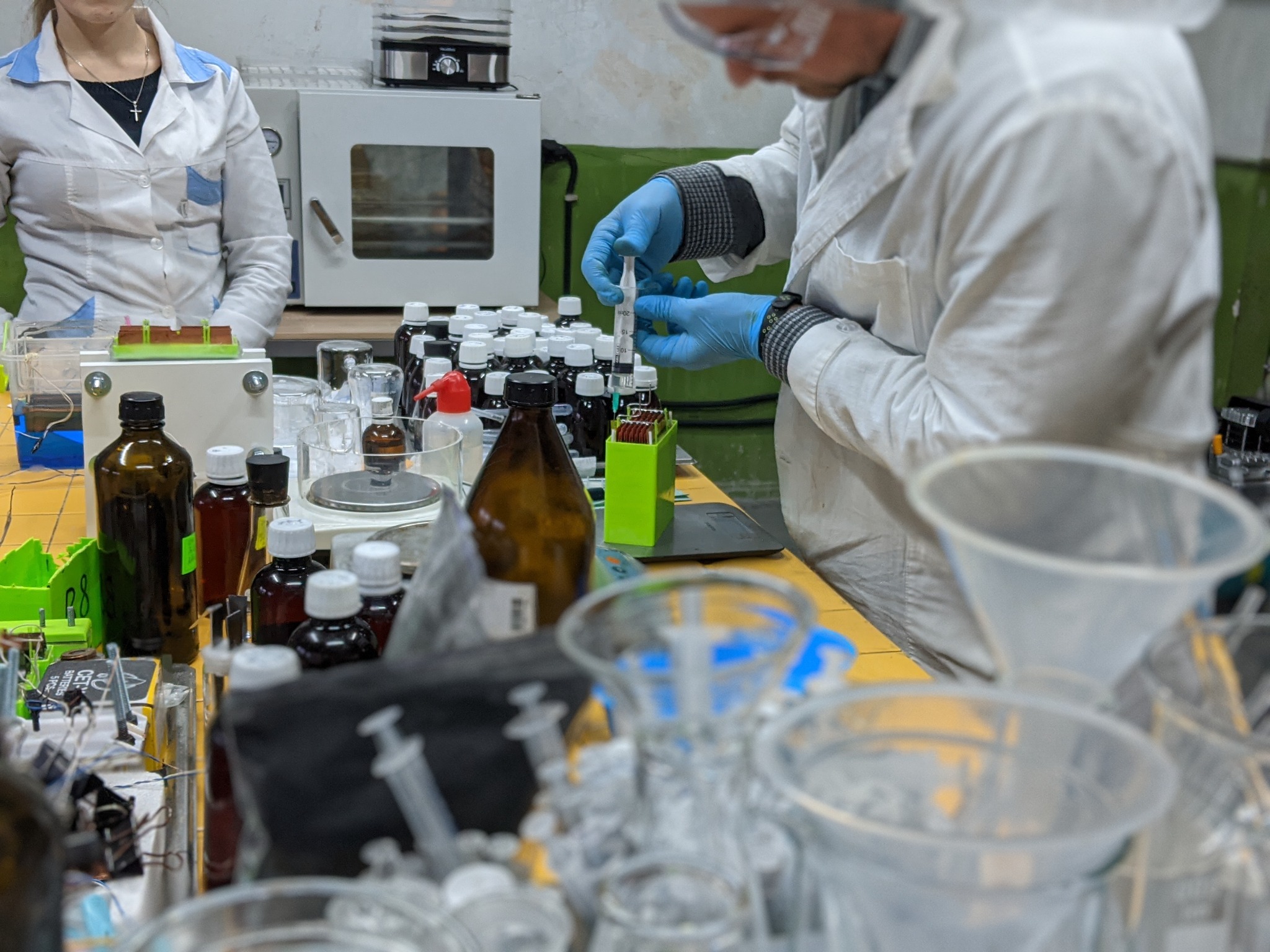 SorbiForce researchers preparing samples at the laboratory bench